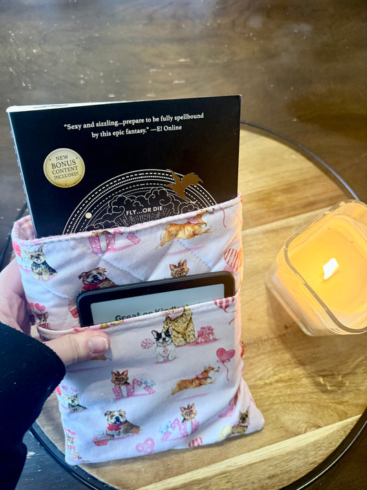 Valentine's dog quilted book sleeve holding a paperback and e-reader
