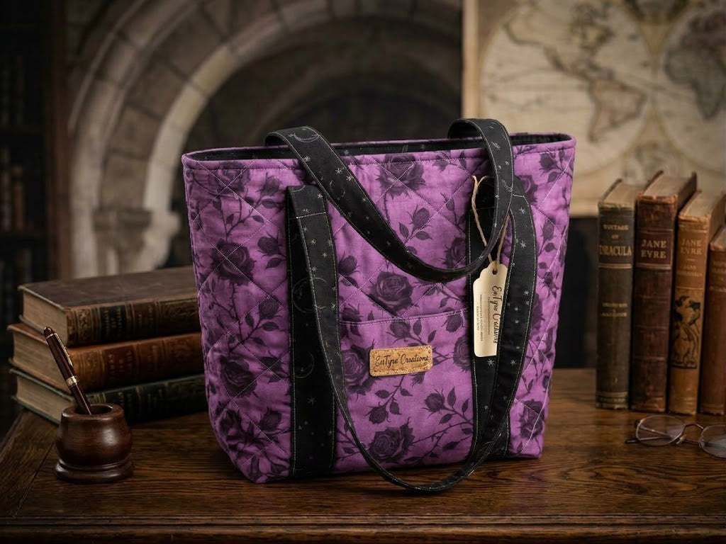 Midnight Scholar quilted tote bag styled in a cozy library with stacked books