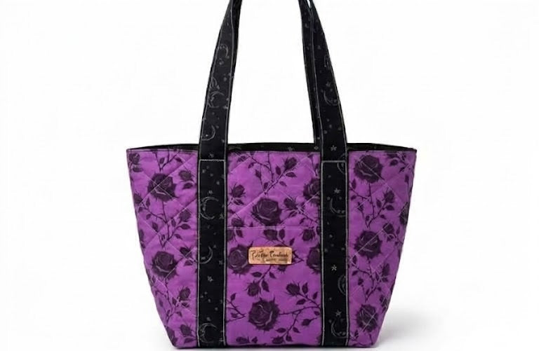 Midnight Scholar quilted tote bag in purple and black rose fabric with black handles
